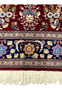 Lower border detail of Persian Isfahan rug with layered guard borders and floral design