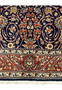 Close-up of red and ivory floral border on Persian Sarough rug