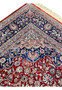 Corner detail of antique Persian Kashan rug with layered border work