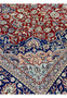 Floral field close-up of antique Kashan rug showing fine hand-knotting