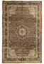 Full view of rare Persian Bijar iron rug with red field, dense lattice pattern, and navy floral border