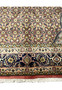 Lower border detail of Persian Bijar iron rug with navy ground and repeating floral motifs
