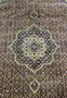 Close-up of medallion on Persian Bijar iron rug showing crisp outlines and dense wool pile