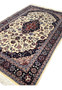 Angled view of 5x8 Persian Tabriz rug revealing pile texture, depth, and color contrast