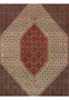 Close up of Persian Bijar rug medallion with red ivory and navy geometric motifs