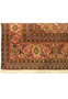 Border detail of Persian Tabriz Mahi rug featuring floral palmettes and warm tones
