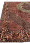 Inner border detail framing the diamond medallion in a hand knotted Persian Bijar iron rug