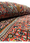 Rolled edge view showing the thickness, weight, and firm construction of a heavy Persian Bijar iron rug
