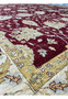 Inner border detail showing ivory and gold floral framing on a Zigler Chobi rug