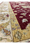 Close-up of the wide gold border with floral motifs on an Oriental Zigler Chobi rug