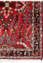 Border close-up of a Persian Darjazin rug displaying layered floral patterns, crisp outlines, traditional village spacing, and saturated natural dye colors