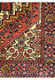 Inner border detail of Persian Gholtogh rug featuring stepped geometric patterns and crisp ivory contrast