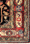 Edge detail of antique Persian Nahavand rug showing sturdy tribal construction, hand-finished sides, and natural wool fibers