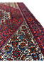 Backside of a Persian Gholtogh rug revealing tight knot structure, even weaving, and craftsmanship quality through visible foundation pattern