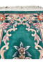 Upper part of this 2'3 x 4'7 Foral 3D Aubusson Art Deco Rug highlighting the floral pattern and deep emerald green field.
