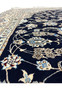 Pattern close-up of a handmade Persian Nain Habibian rug showing fine curvilinear floral motifs and scrolling vines woven with precise 6LA detail