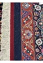 Backside view of a hand-knotted Persian Mashad rug revealing dense knot structure, precise craftsmanship, and the high-quality kork wool foundation.