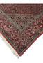Outer edge detail of a Persian Bijar iron rug featuring strong binding, crisp borders, red wool edge finish, and long-lasting hand-knotted construction