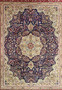 Close view of Persian Tabriz rug midfield with deep navy background, layered floral motifs, fine knotting, and rich color contrast