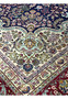Inner border detail of an 11'2 x 14'4 Persian Tabriz rug with ivory ground, floral scrollwork, and refined navy outlines