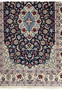 Lower section of Persian Isfahan wool and silk rug showing border clarity, floral repeats, and consistent fine knot weaving
