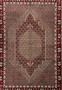 Midfield detail of Persian Senneh rug showing tightly packed geometric lattice, ivory outlines, dark brown accents, and rhythmic repeating motifs