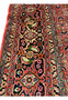 Border close-up of Persian Bijar rug displaying crisp floral detailing and saturated natural dyes