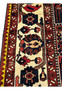 Zoomed view of the ivory floral border on a 7'4 x 10'1 Persian Bakhtiar garden rug showing vine motifs, rich reds, navy accents, and hand-knotted wool texture