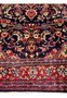 Lower border detail Persian Mahal rug showing red floral guard borders navy bands and wool pile texture