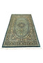 Angled laid flat view of silk Persian Qum rug highlighting sheen, medallion symmetry and dense knot precision
