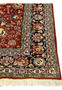 Navy main border with large palmettes ivory outlines and scrolling vines classic Tabriz floral design close up
