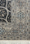 Detailed border of Persian Nain Habibian rug with scrolling vines ivory and light blue floral motifs silk accents.