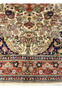 Lower border of Persian Bijar rug featuring coral red main border navy guard stripes and floral vine motifs