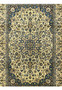 Close view of ivory midfield on Persian Kashan rug with detailed floral motifs blue highlights and fine wool knotting