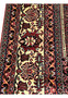 Border close up of 8'2 x 11'4 Persian Bijar Iron Rug with ivory floral elements, red field contrast and heavy hand knotted construction