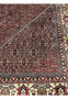 Inner border detail of 8'2 x 11'4 Persian Bijar Iron Rug in deep red and ivory showing geometric floral guard bands and dense hand knotted wool