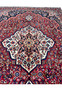 Central ivory star medallion of Persian Bakhtiari rug 10'9 x 13'7, hand-knotted with salmon and navy detail.