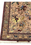 Animal border detail of 5x8 Persian Isfahan Seirafian rug with camels, deer and floral vine