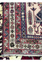 Back of 5x8 Persian Afshar tribal rug showing hand-knotted wool construction and knot density