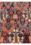 Close-up of floral motifs in antique 3'7x5 Persian Bakhtiari wool rug, navy orange teal ivory