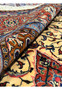 9x13 Persian Sarough rug rolled detail ivory rust navy pile wool construction closeup