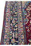 10x13 distressed antique Persian Mashad rug border closeup navy floral rosettes pink accents