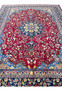 10x13 distressed antique Persian Mashad rug top view red field navy border paisley spandrels