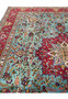 Field view of 10x13 Persian Tabriz rug, sky blue ground with floral bouquets and curling vines