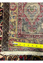 Back of 10x13 Persian Tabriz rug with ruler showing approximately 220 to 240 KPSI hand-knotted weave