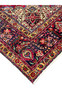 Edge view of 10x13 Persian Tabriz rug, ivory corner spandrel and navy main border