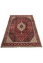 Handmade Bijar iron rug 10x13 laid flat, showing classic Herati fish pattern for living room