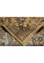 Folded edge revealing the soft hand of this hand knotted Agra wool rug on cotton foundation