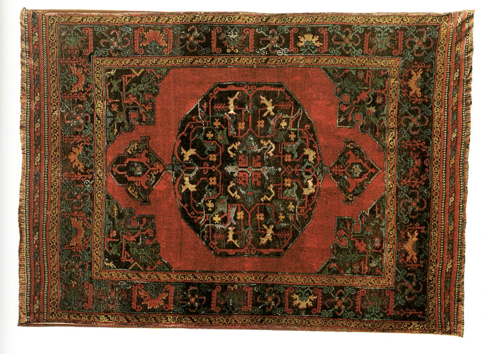 An antique 16th century Anatolian Oushak rug with a bold geometric interlaced arabesque