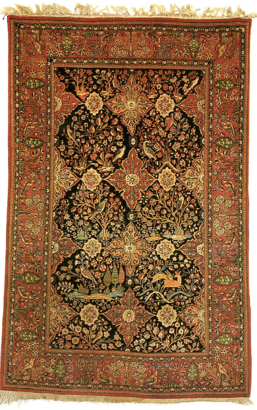 A 19th century Kashan rug with an animal pattern of creatures among floral motifs